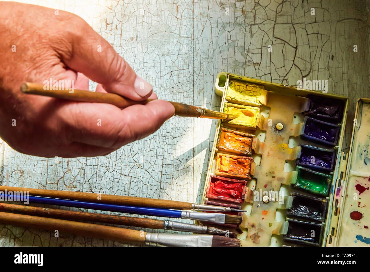 Paint accessories On a wooden table Cyan.Painting job This requires  much-needed tools to work. Stock Photo