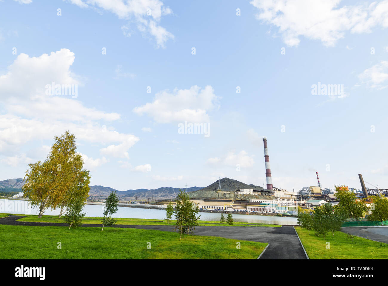 Karabash city in autumn, view of the copper plant and the mountain of black slag. The dirtiest city in the world. Horizontal photography Stock Photo
