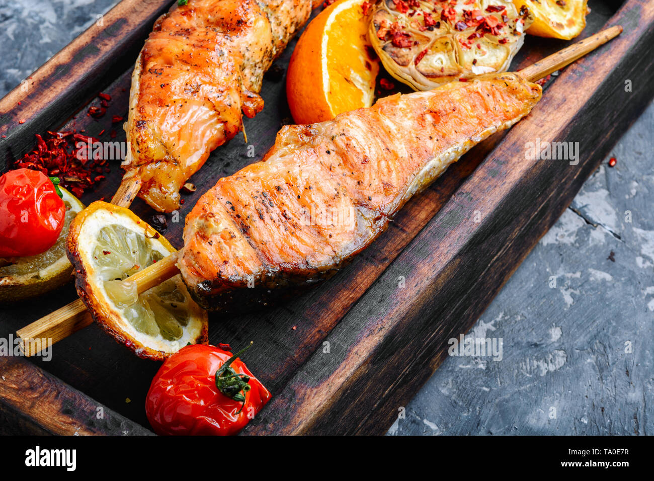 Grilled fish, grilled salmon steak with addition of lemon Stock Photo