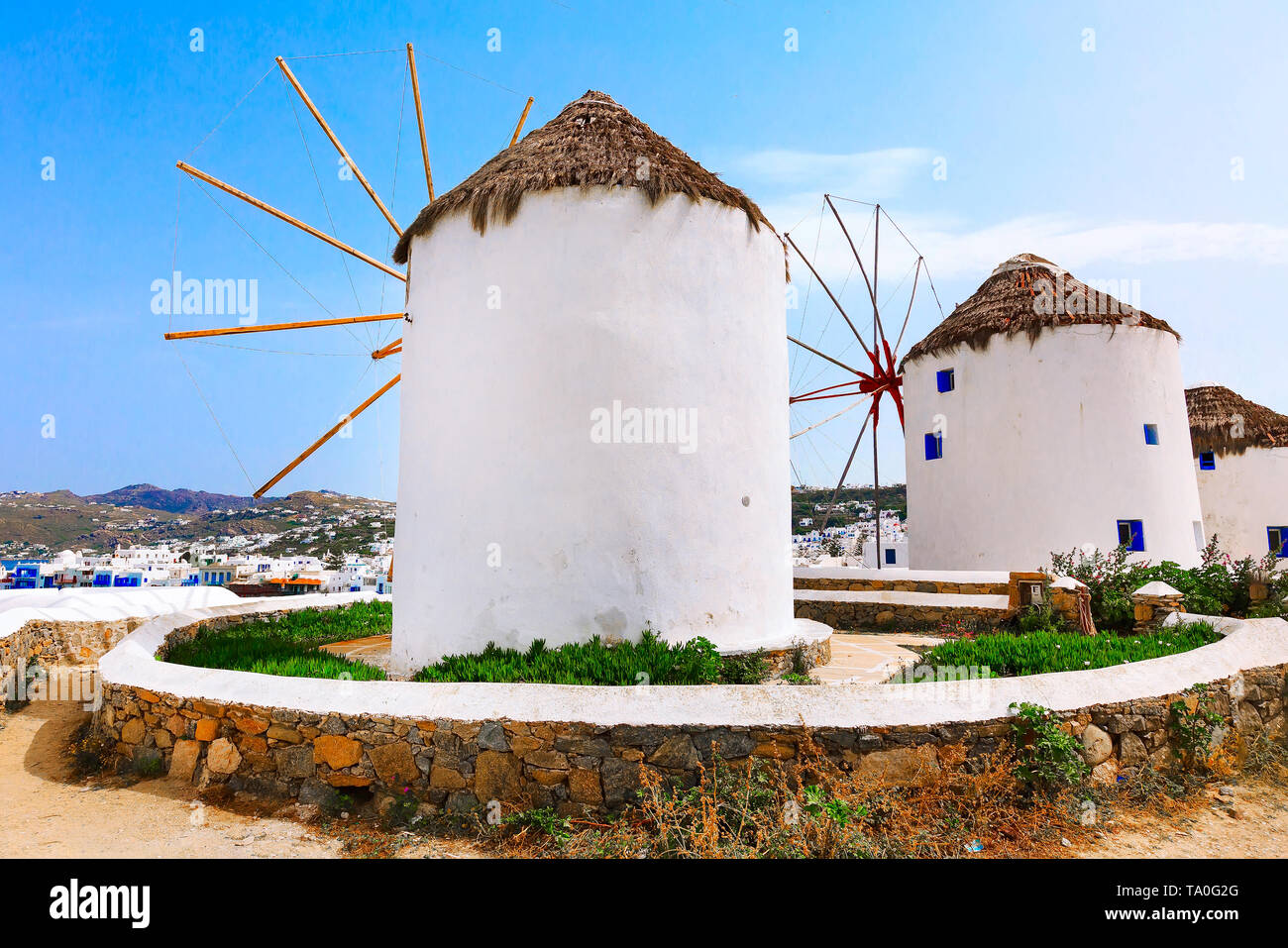 Greek iconic windmills and little venice panorama in Mykonos, Greece, famous island in Cyclades Stock Photo