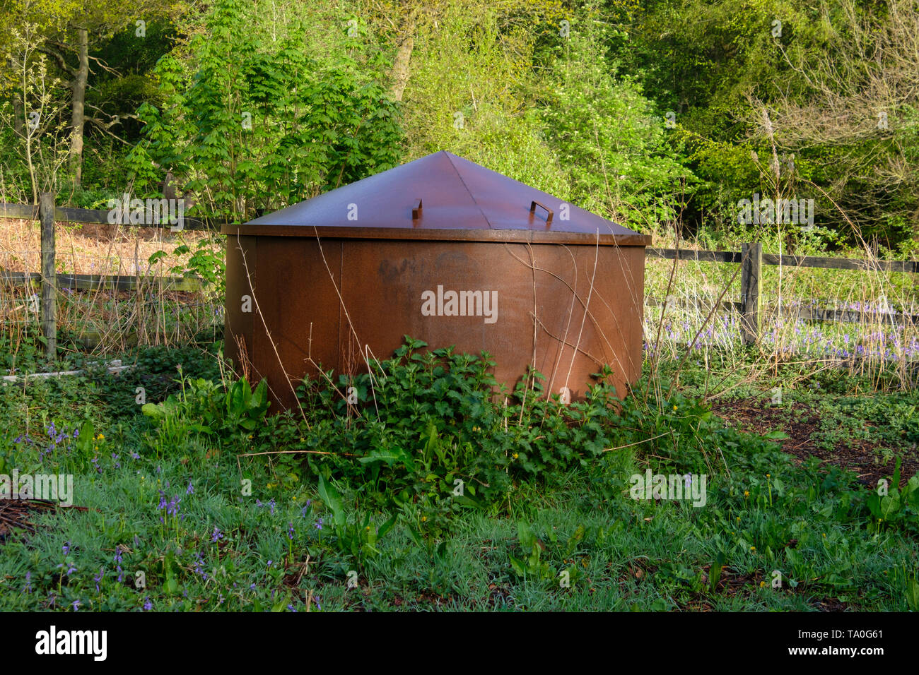 A charcoal burner in woddland. Stock Photo