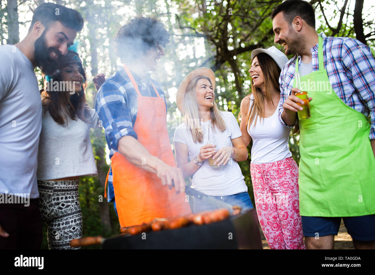 Group of friends having a barbecue party in nature Stock Photo - Alamy