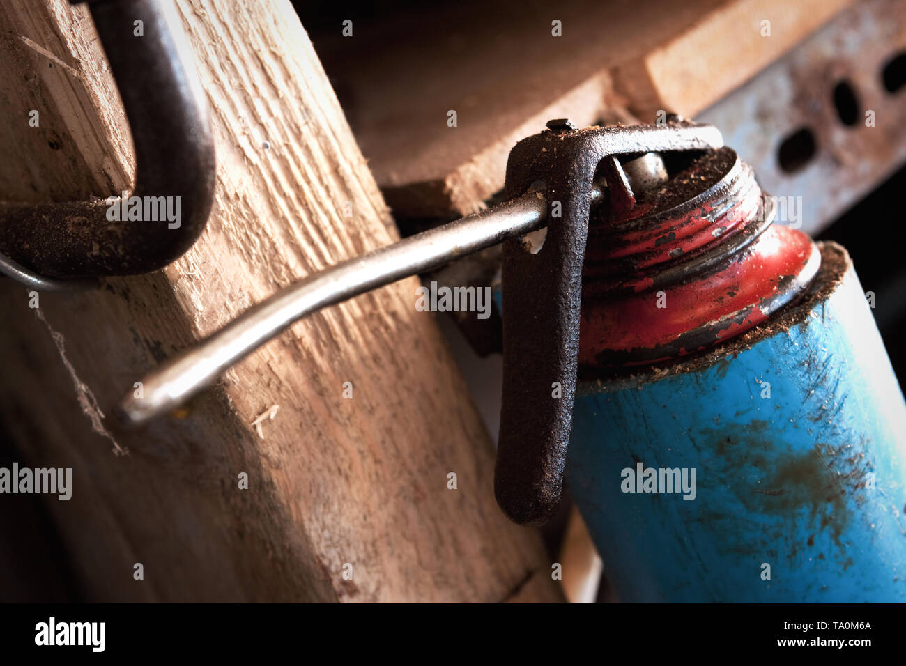 An oil can in a woodwork workshop or shed. Stock Photo