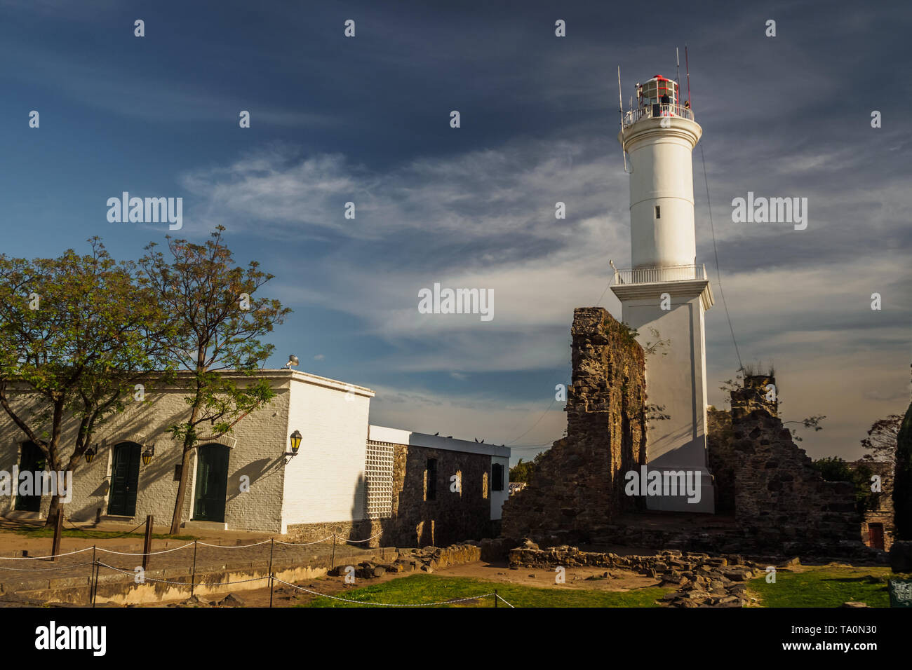 Lighthouse of Colonia del Sacramento in Uruguay, with ruin by its side Stock Photo