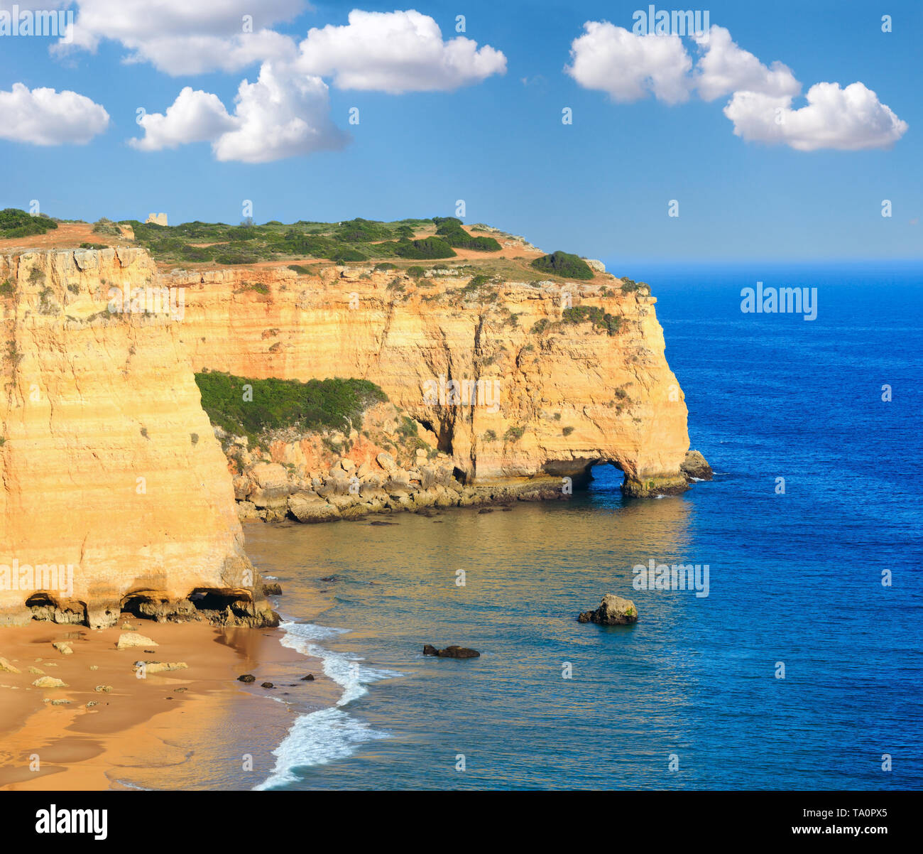 Summer Atlantic rocky coast view with sandy beach Praia da Afurada, Lagoa, Algarve, Portugal Stock Photo