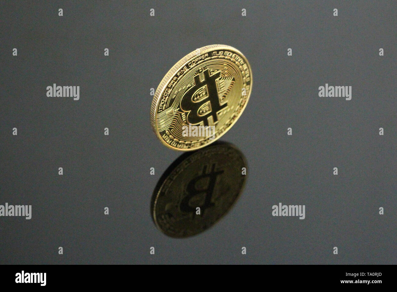 One gold coin bitcoin on a black background. Bitcoin is on its side. One  can see his reflection. Cryptocurrency concept gold bitcoin. No people,  empty Stock Photo - Alamy