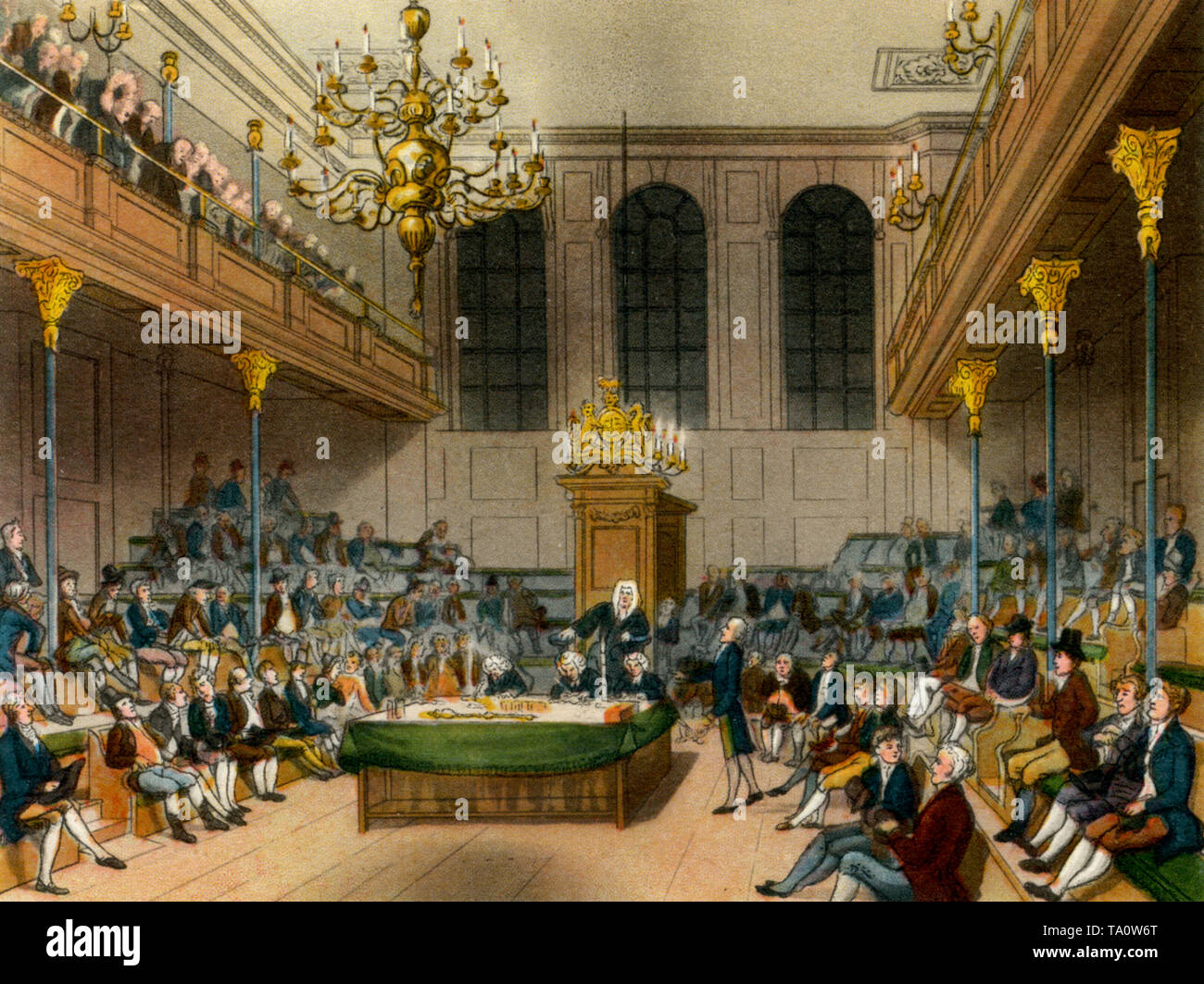 House of Commons, c1808-1810. A print from 'The Microcosm of London', by William Henry Pyne (1770-1843). By Thomas Rowlandson (1756-1827) and Auguste Charles Pugin (1762–1832). The medieval Commons Chamber seen here prior to its destruction by fire in 1834. The new Palace of Westminster was partly designed by Auguste Charles Pugin's son, Augustus Welby Pugin (1812-1852). Stock Photo