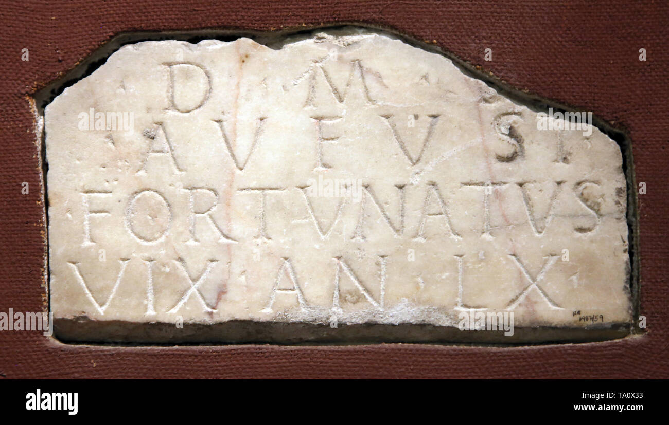 Roman tombstone. Aufustio Fortunato, 60 years, Liberto. 1st-2nd centuries. Archaeological Museum of Seville. Spain. Stock Photo