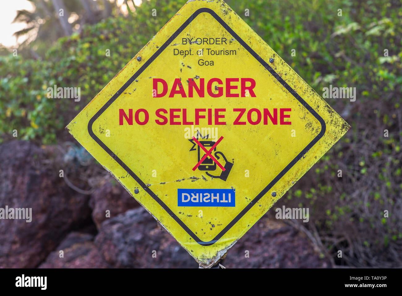 A sign on a beach warning for selfies. Stock Photo