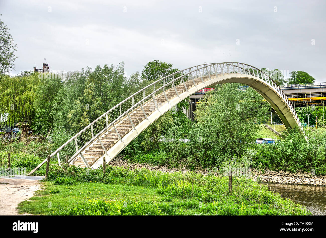Nijmegen, The Netherlands, April 25, 2019: the Ooypoort pedestrian bridge, made of composite material, connects the city with Ooijpolder nature reserv Stock Photo