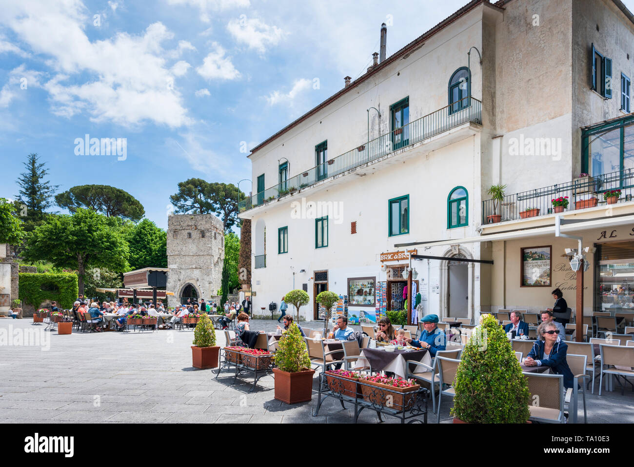 Pavement cafe and restaurants in Piazza Duomo the maincentral square in the hilltop village of Ravello above the Amafli Coast in Campania Italy Stock Photo