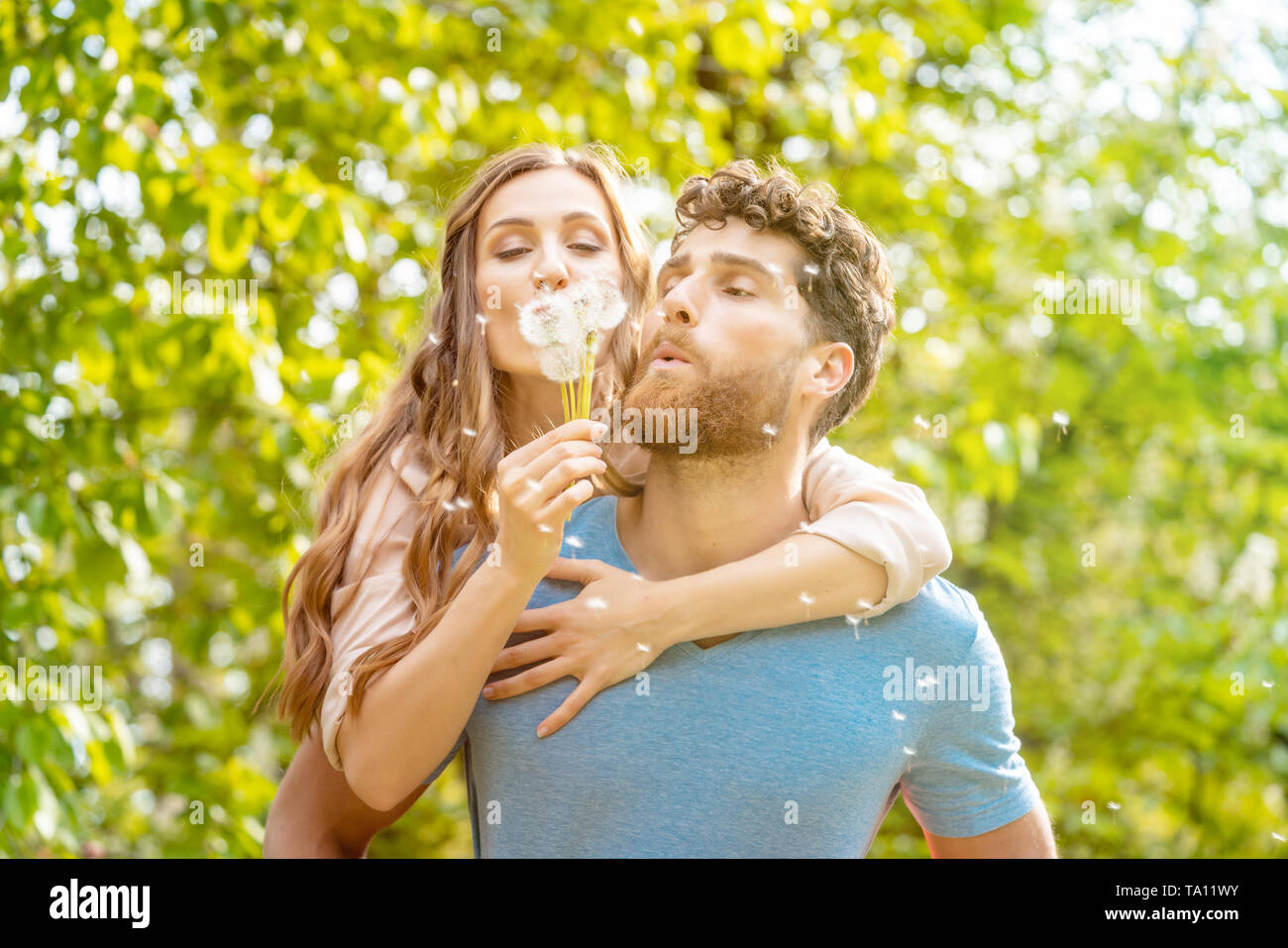 Romantic man carrying woman in hi-res stock photography and images - Alamy