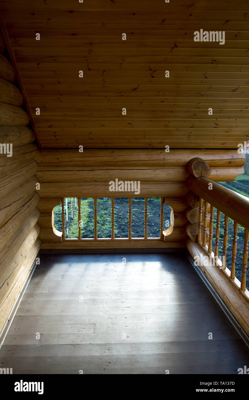 element of the balcony of the house from the Russian house from round logs Stock Photo