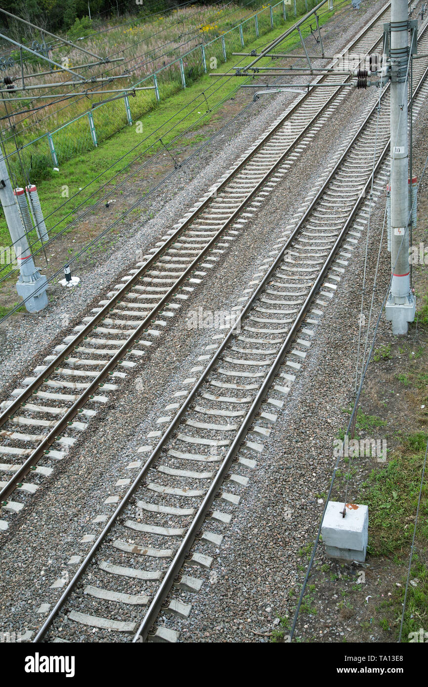 electrified railway tracks top view on a summer day Stock Photo