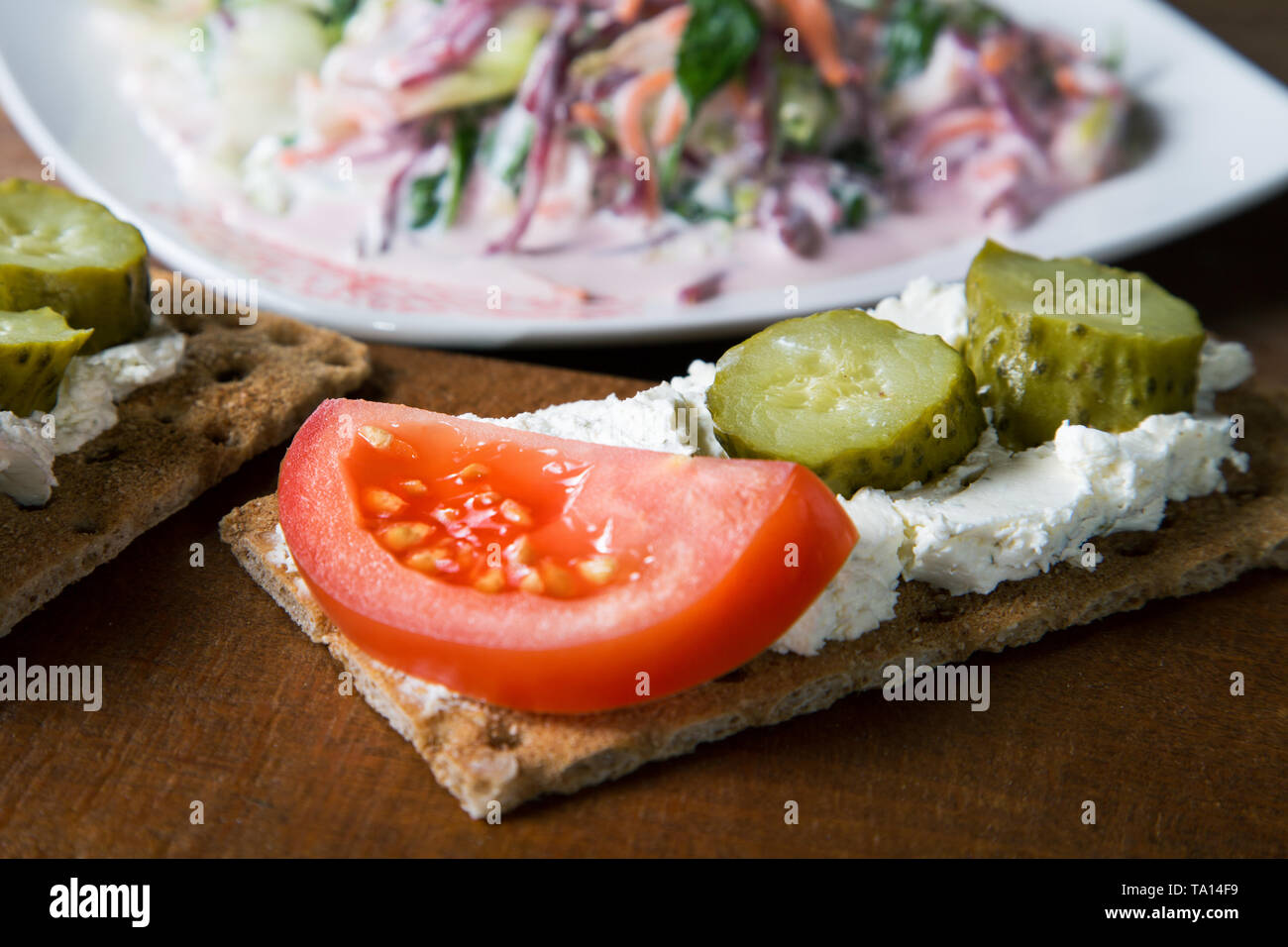 still life with a plate of vegetable salad and tartlets Stock Photo