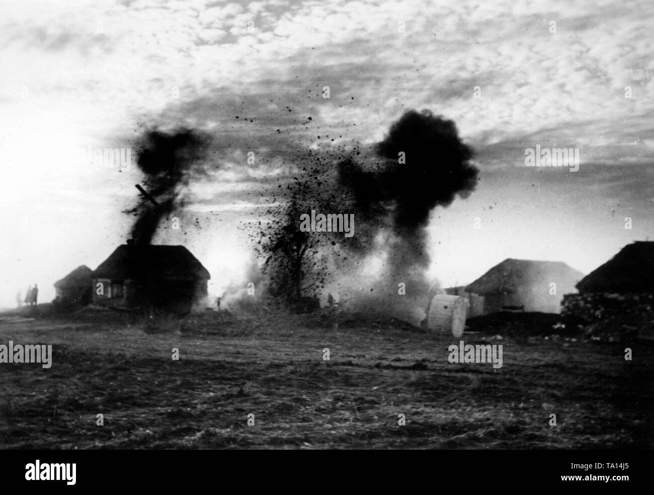 German soldiers are bombing a village in Russia. Stock Photo