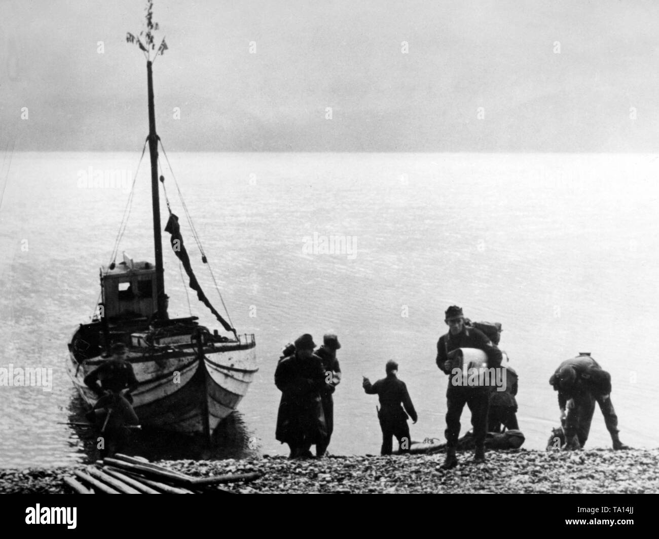 The replacement of a signal communication troop arrives at its destination with a ferry across the fjord on the coast of Norway. Photo of the Propaganda Company (PK): War correspondent Ruemmler. Stock Photo