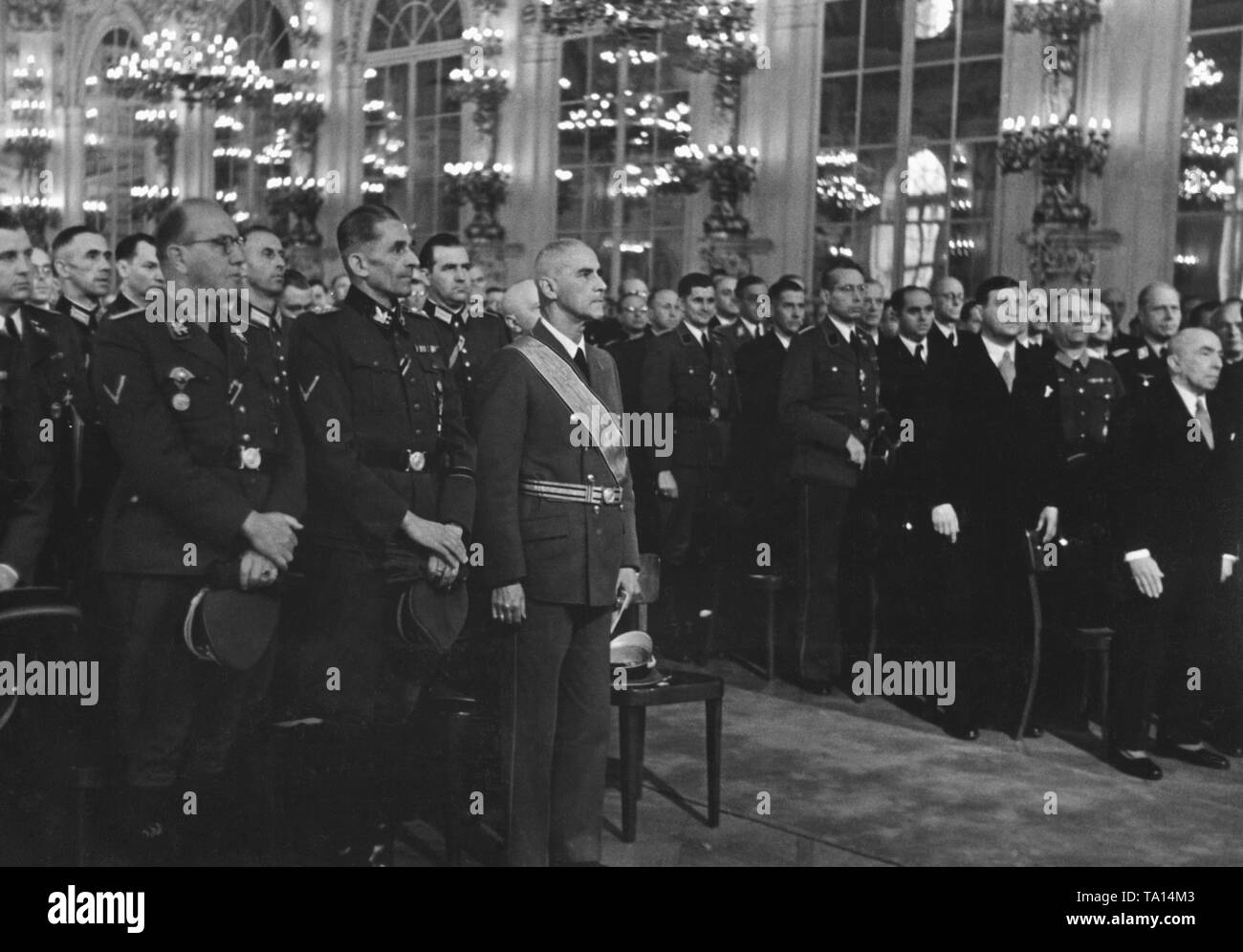After the Operation Anthropoid, Wilhelm Frick (3rd from left) is inaugurated as Reichsprotektor of Bohemia and Moravia. The celebrations take place in the Spanischer Saal (Spanish Hall) of Prague Castle. To Frick's left, SS Obergruppenfuehrer Karl Hermann Frank and on the right, President Emil Hacha. Stock Photo
