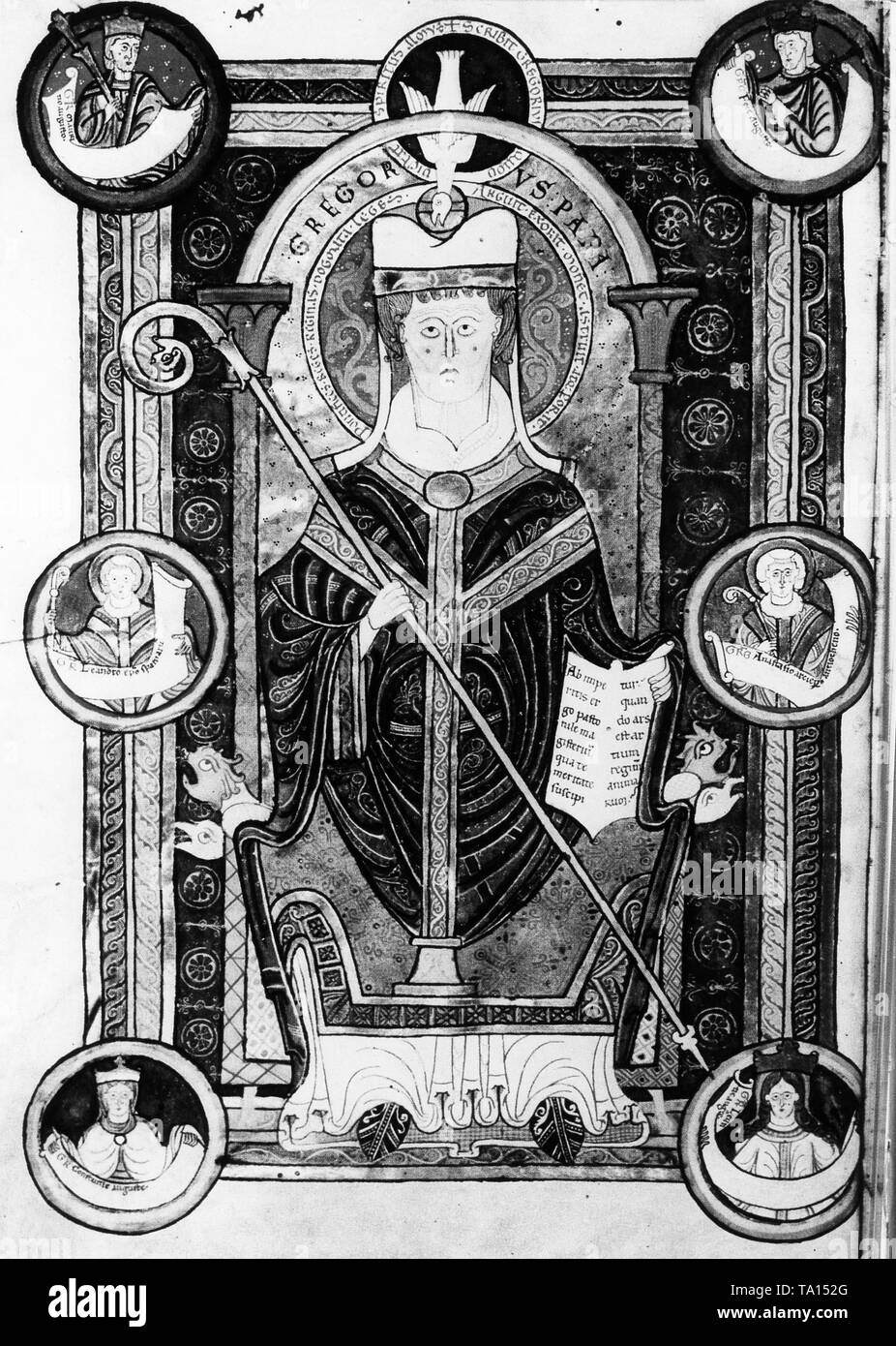 Illustration of the Abbey of St. Martin, Tournai (Epistles of Saint Gregory), circa 1150. Pope Gregory enthroned with crozier and book inspired by the Holy Spirit. Frame with six medallions with busts of his correspondents. Stock Photo