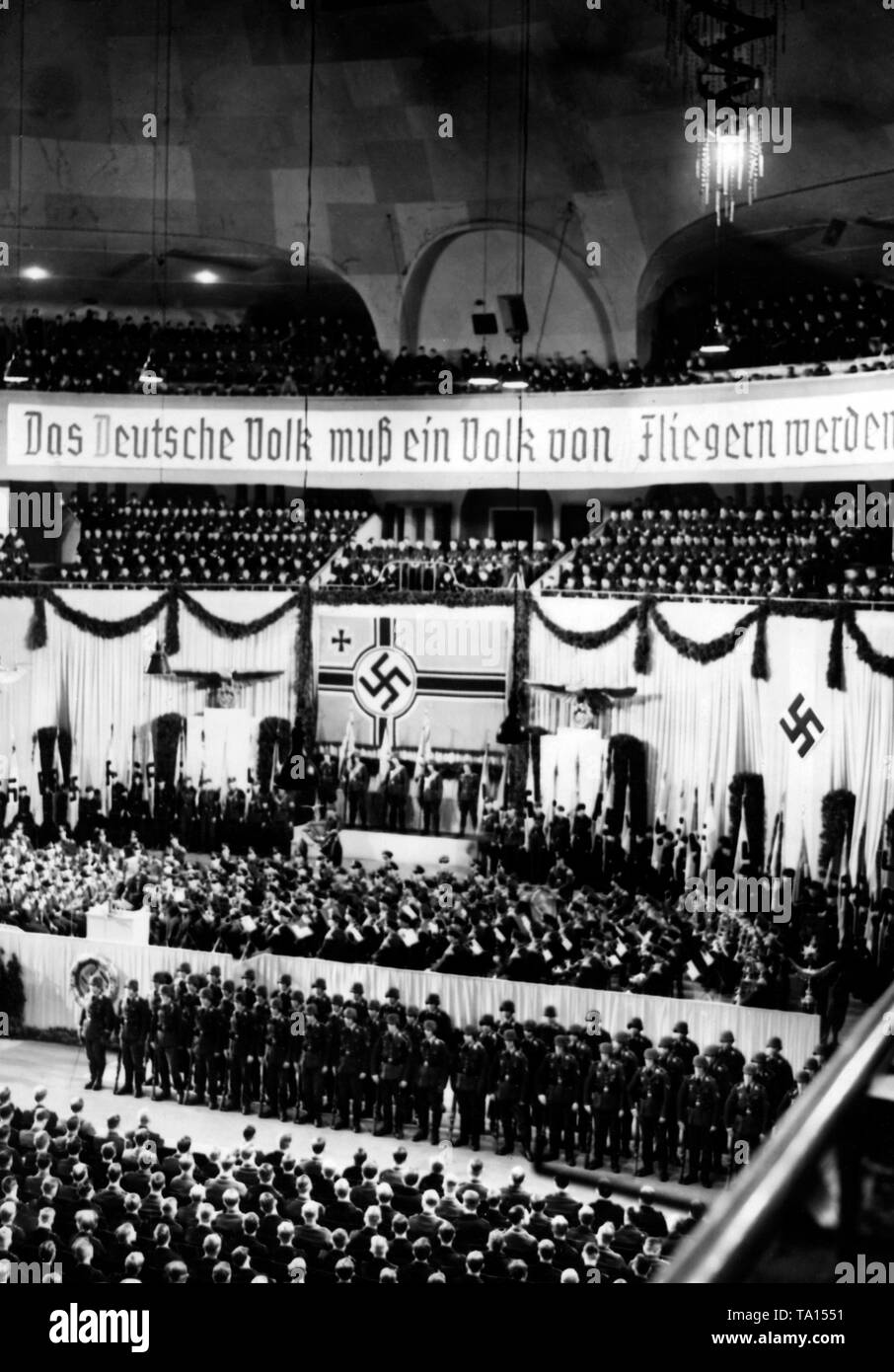 View of the Berlin Sportpalast during the rally of the Luftwaffe Propaganda Week. Reichsmarschall Hermann Goering had ordered this event. In the background, a banner with the inscription 'The German nation must become a nation of airmen'. Stock Photo