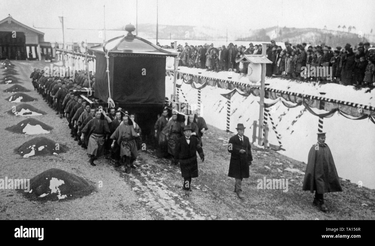 A rehearsal is being held before the actual funeral of Emperor Yoshihito who died on December 25, 1926. The bearers carry the bier in which the corpse is to be transported. Stock Photo
