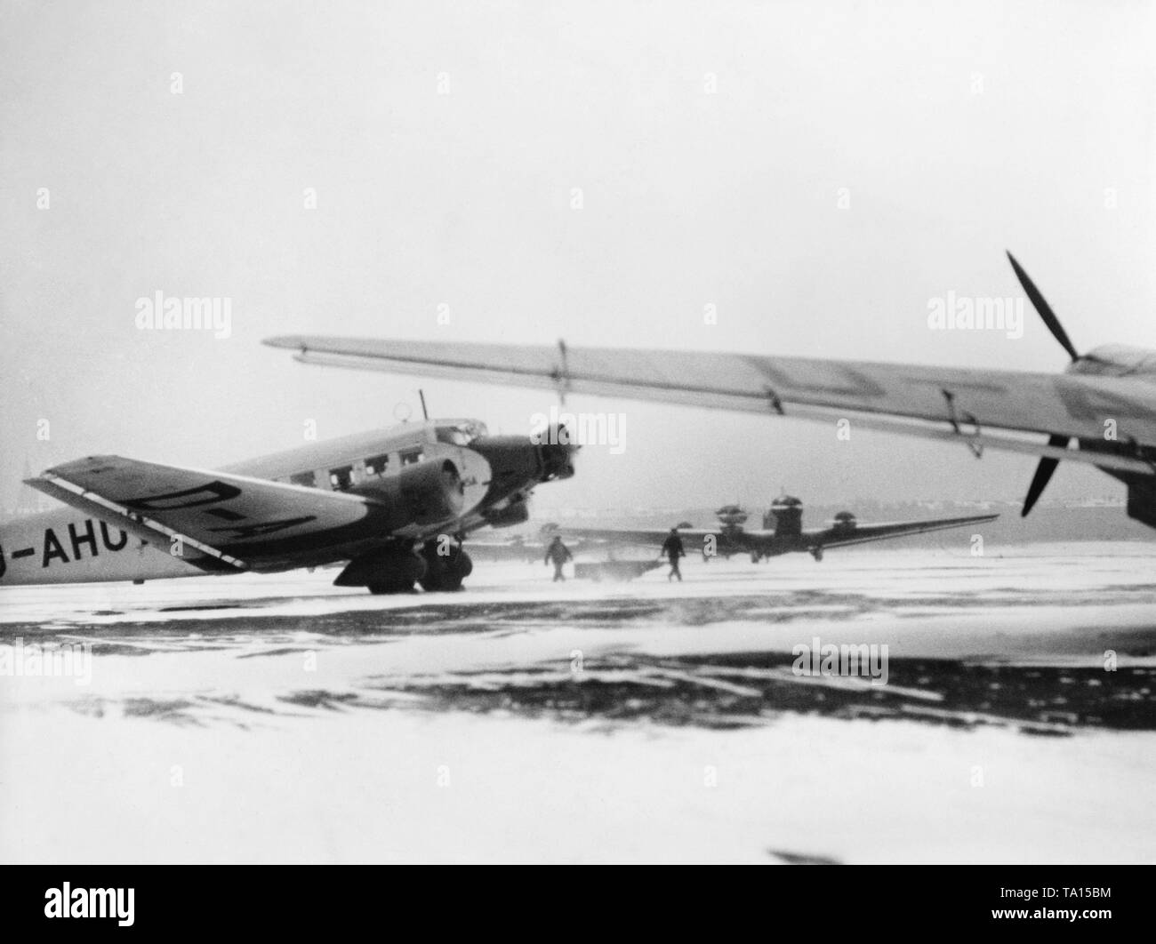 Junkers Ju52 are waiting for take-off at the snow-covered Berlin-Tempelhof Airport. Stock Photo