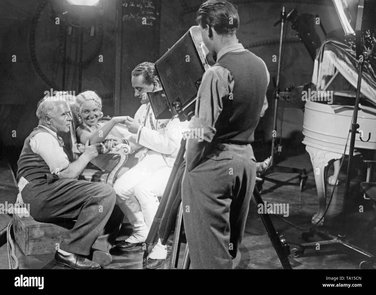 This photo shows director Carl Froehlich, to whom Max Hansen plays a