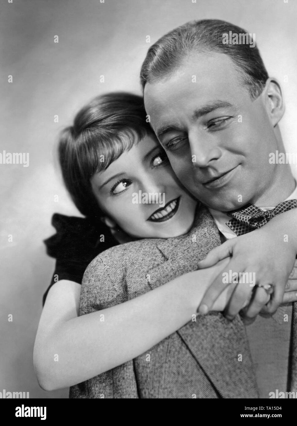 Heinz Ruehmann as Fred Holmes and Dolly Haas as Edith Ringler in the feature film 'Things Are Getting Better Already' by Kurt Gerron. This movie has disappeared. Stock Photo