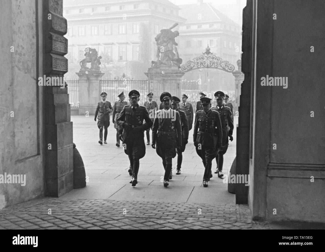 The State Secretary of the Protectorate of Bohemia and Moravia, Karl Hermann Frank, the new Reich Protector for Bohemia and Moravia, Wilhelm Frick and the General der Panzertruppe Ferdinand Schaal enter the Prague Castle. After the assassination of Reinhard Heydrich, Frick becomes the new Reich Protector in 1943. Stock Photo