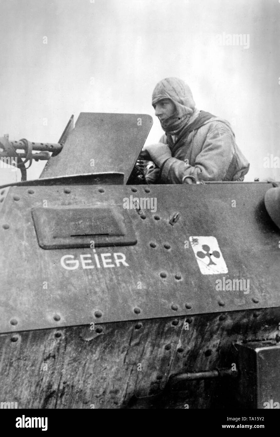 An MG gunman on an armored personnel carrier  Sd.Kfz. 250 during the winter defensive battles south of Rostov. Photo of the Propaganda Company (PK): war correspondent Casper. Stock Photo