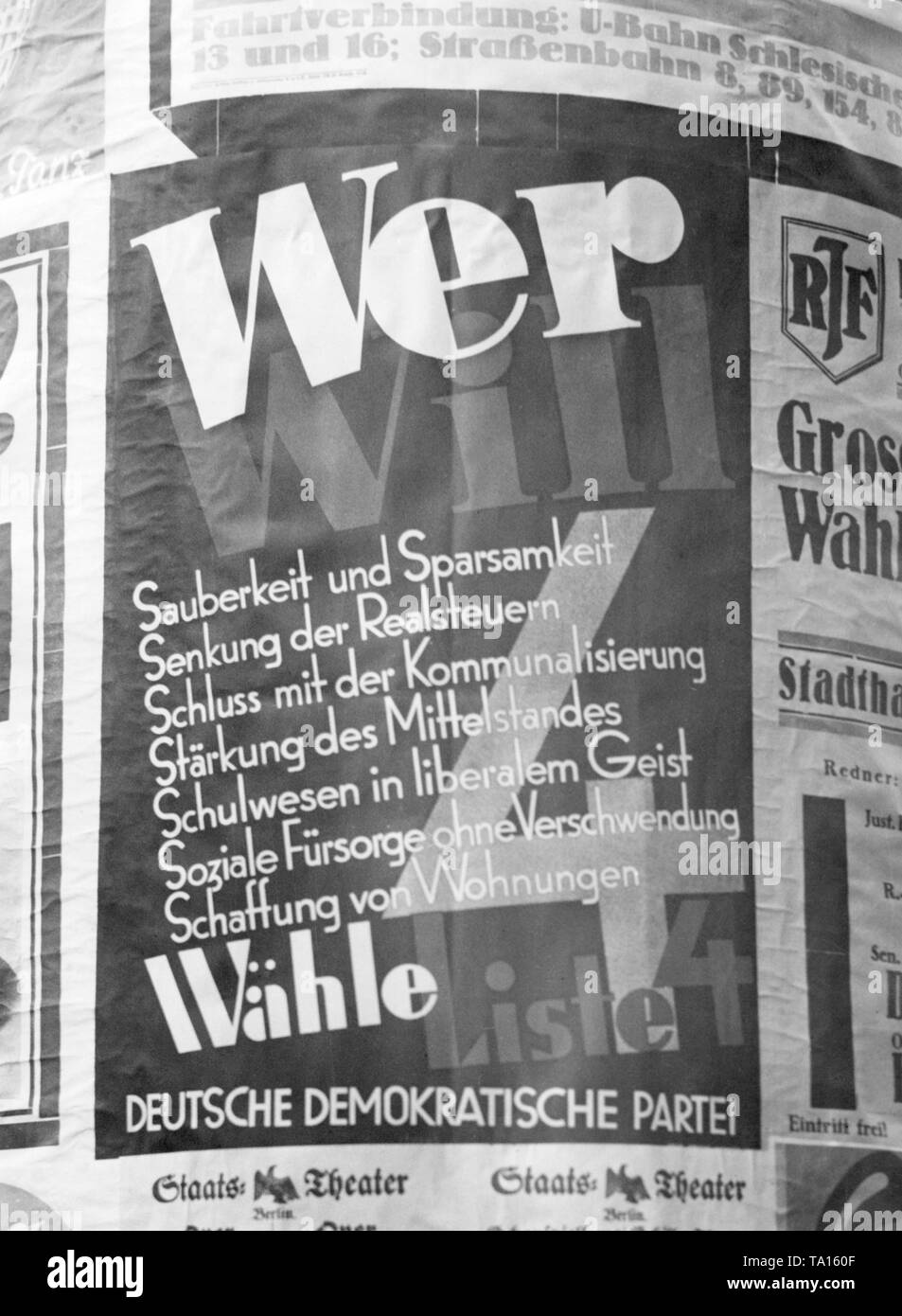 Election poster of the German Democratic Party on an advertising column in Berlin. At the end a list of the electoral advantages of the DDP, there is the sentence to be read: 'Vote for List 4'. Stock Photo