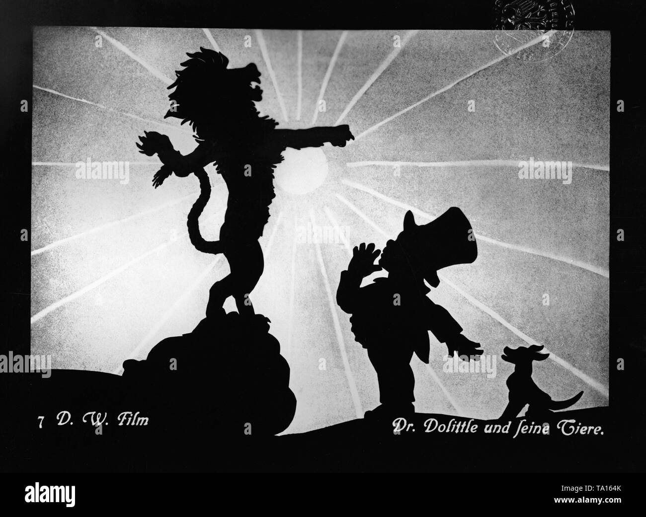 Picture from the silhouette film "Dr. Dolittle and his Animals" by Charlotte Reiniger. The silhouette film, also known as silhouette animation, is a technique of animated film in which silhouettes are put together on a lighted glass plate in front of a white or black background to form a film. The result is the silhouette film, inspired by shadow theater and the pictorial techniques of silhouette cutting. Stock Photo