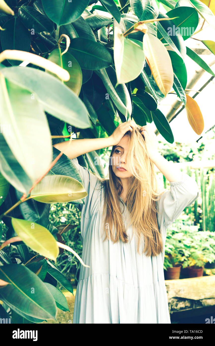 Tropical greenhouse girl hi-res stock photography and images - Alamy