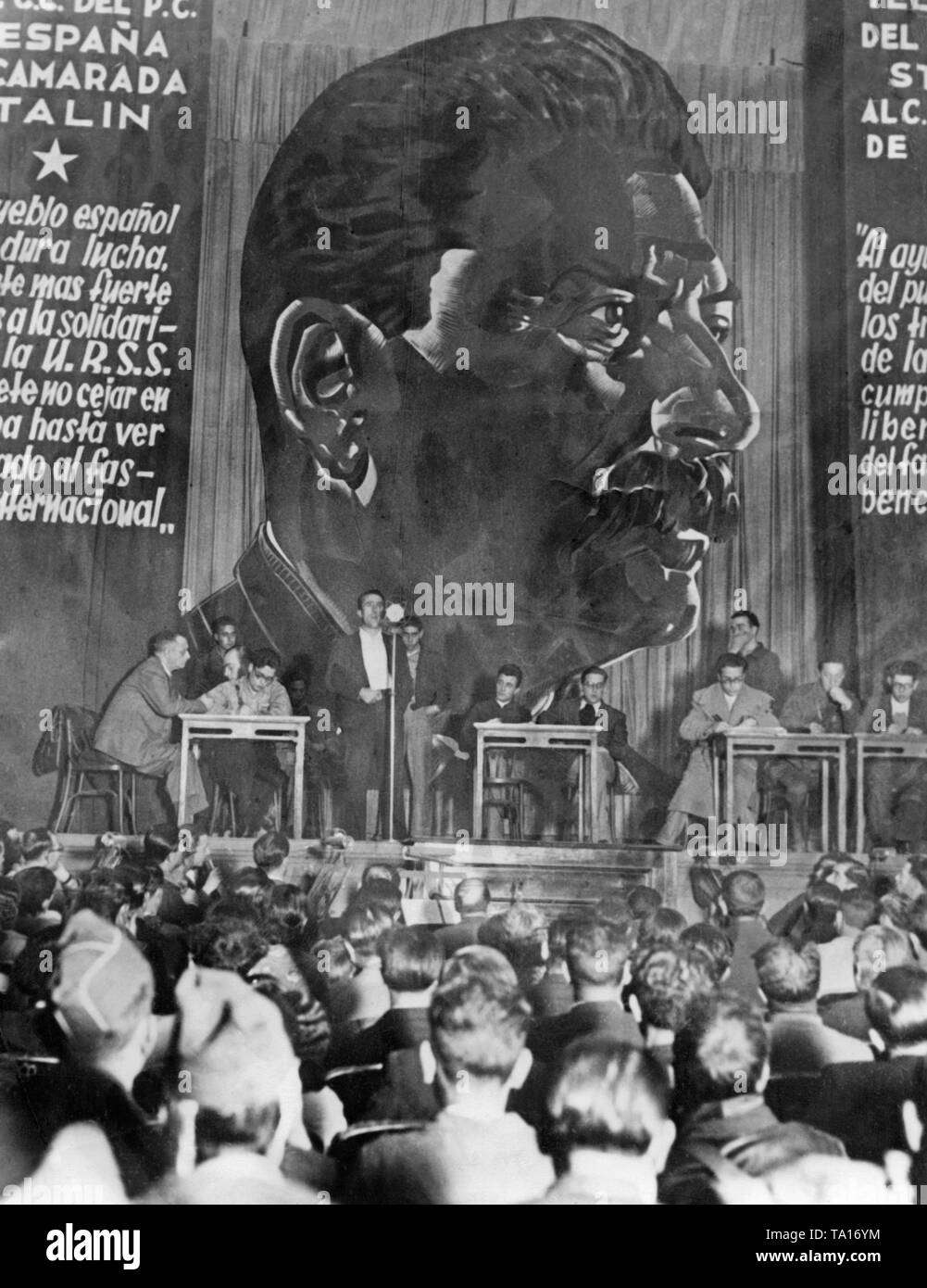 At an event of the Spanish Communist Party (Partido Comunista de Espana) in Madrid during the siege of the city. Stalin's portrait was supposed to express the need of the troops of the republic for support by the Soviet Union. In addition to the portait, Stalin quotes translated into Spanish also express the solidarity of the Soviet Union for Spain. Stock Photo