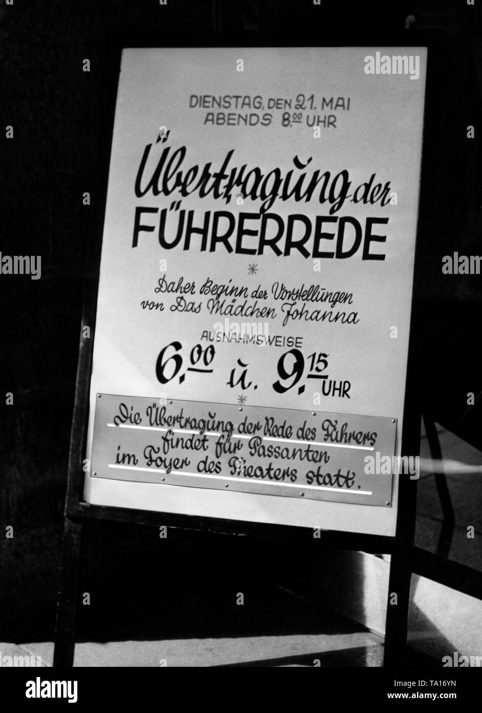 This notice informs about the broadcast of Adolf Hitler's speech in a theater, which is why the performace 'Das Maedchen Johanna' ??('The girl Johanna') was postponed. About two months after the introduction of the general conscription, Hitler declared his intention of peace in his Reichstag speech. Stock Photo