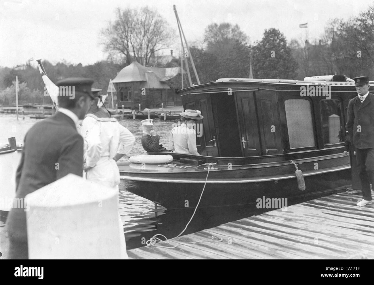 Crown Prince Wilhelm sits with his wife Crown Princess Cecilie on the deck of a ship on the Havel. The ship is moored to a jetty. Stock Photo