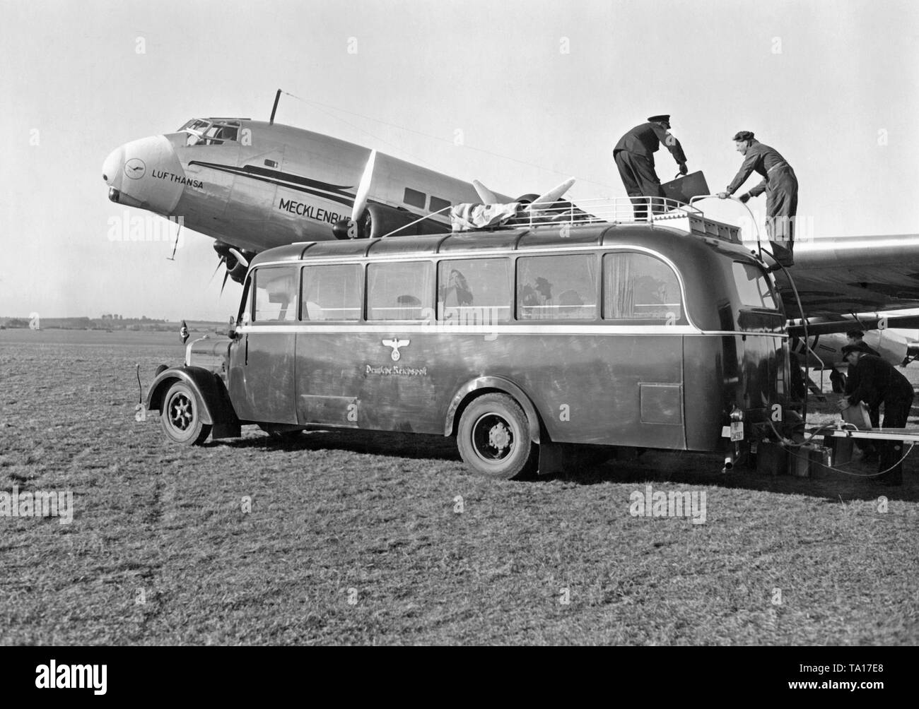 A Junkers Ju 90 of the Deutsche Lufthansa is refueled and loaded before a flight from Rangsdorf near Berlin to Vienna. Stock Photo