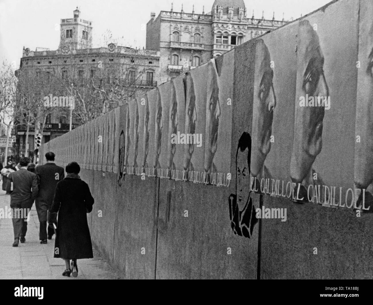 A row of propaganda posters of General Francisco Franco (Caudillo) in the center of Barcelona in February / March 1939 shortly before the end of the civil war. Stock Photo