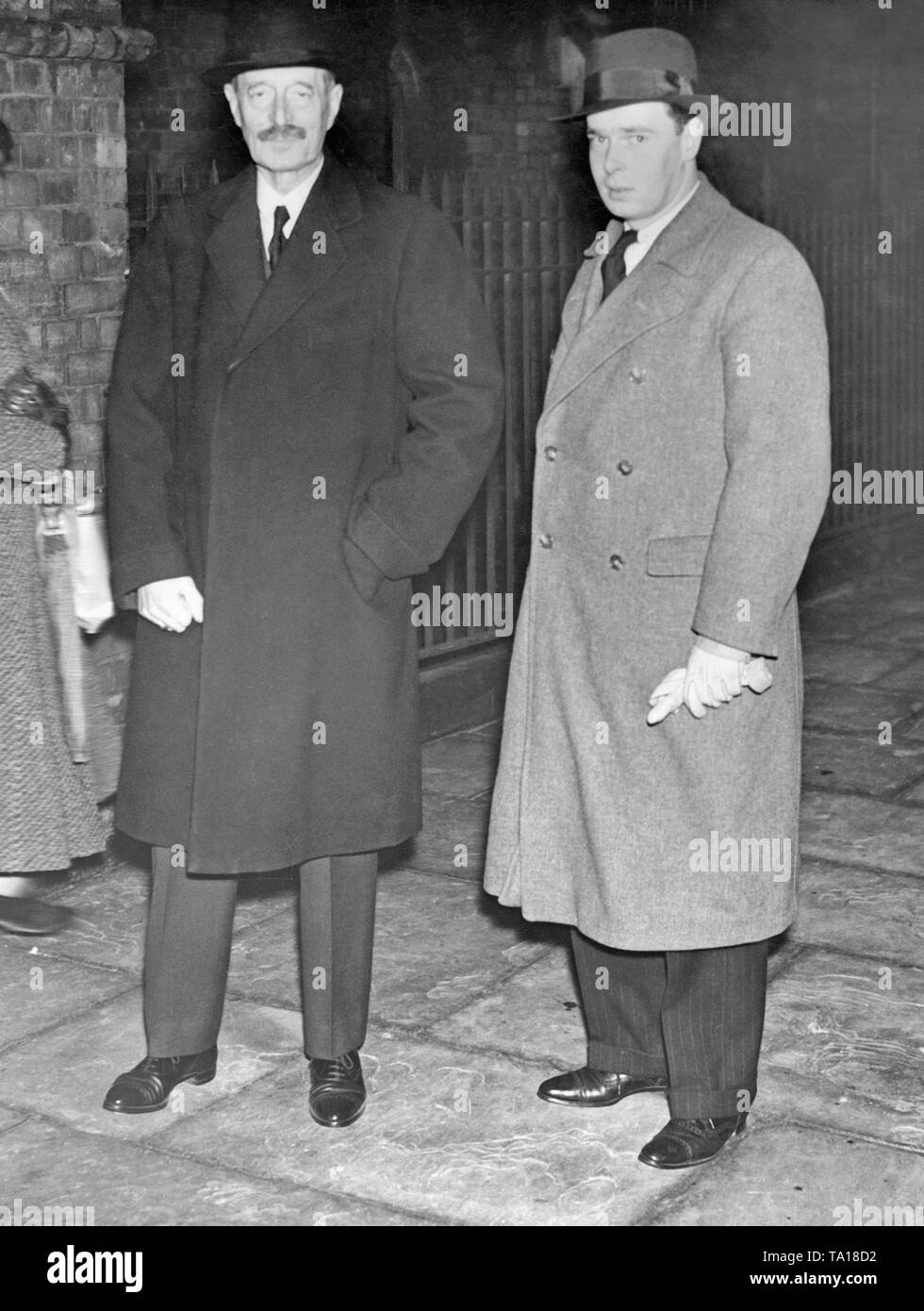 Grand Duke Kyrill Vladimirovich Romanov (left) and his son Vladimir Kirillovich Romanov before a Christmas service in the Russian Orthodox Church on London's Buckingham Palace Road. After the death of Tsar Nicholas, Cyril claimed the Tsar's throne and called himself 'Emperor in Exile' until his death. Stock Photo