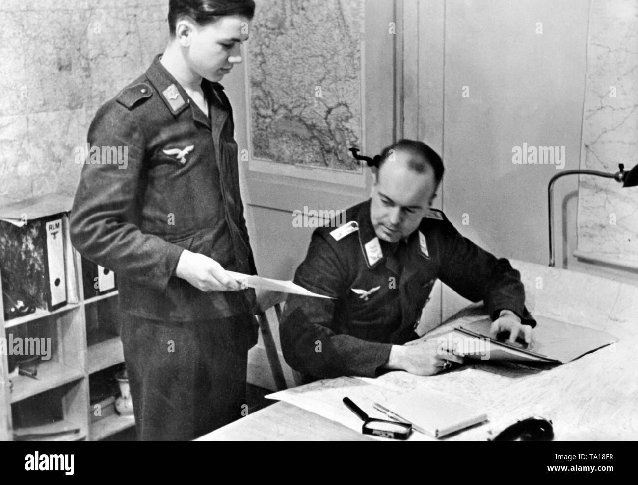 An orderly officer of the Luftwaffe on the eastern front issued a radio message to his superior officer. Photo: war correspondent Standartenfuehrer Seuffert. Stock Photo