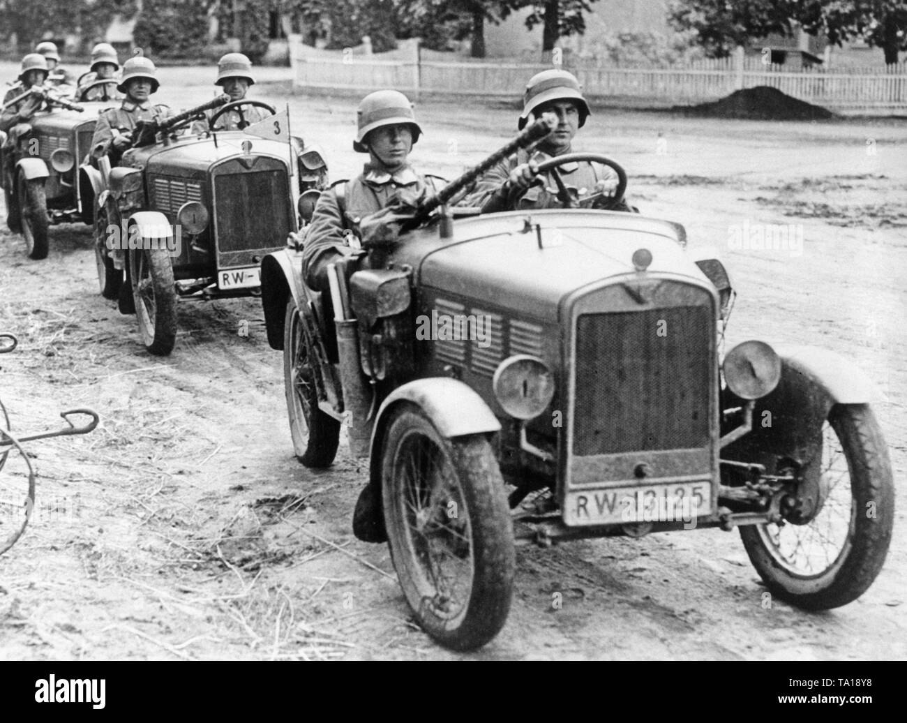 A BMW Dixi 3/15 converted to machine gun car during an exercise of the Reichswehr. Since the Reichswehr was prohibited by the Treaty of Versailles to operate tanks, the training of tank drivers mas carried out with BMW Dixis, on which were put some tank dummies made of plywood. Stock Photo
