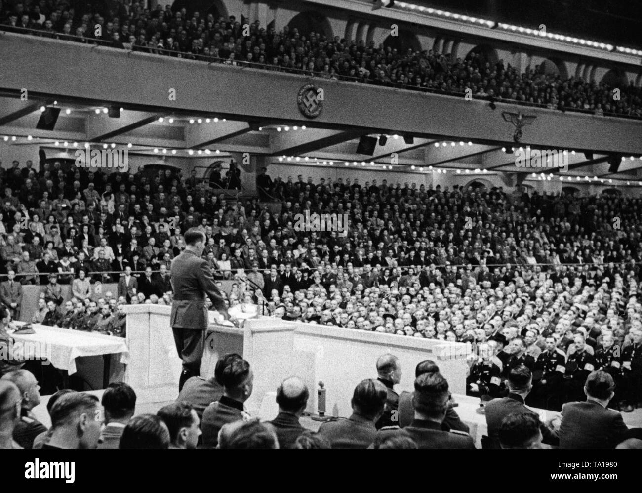Albert Speer gave a speech at the Sportpalast in Berlin. Left sitting at the table, Joseph Goebbels. Stock Photo