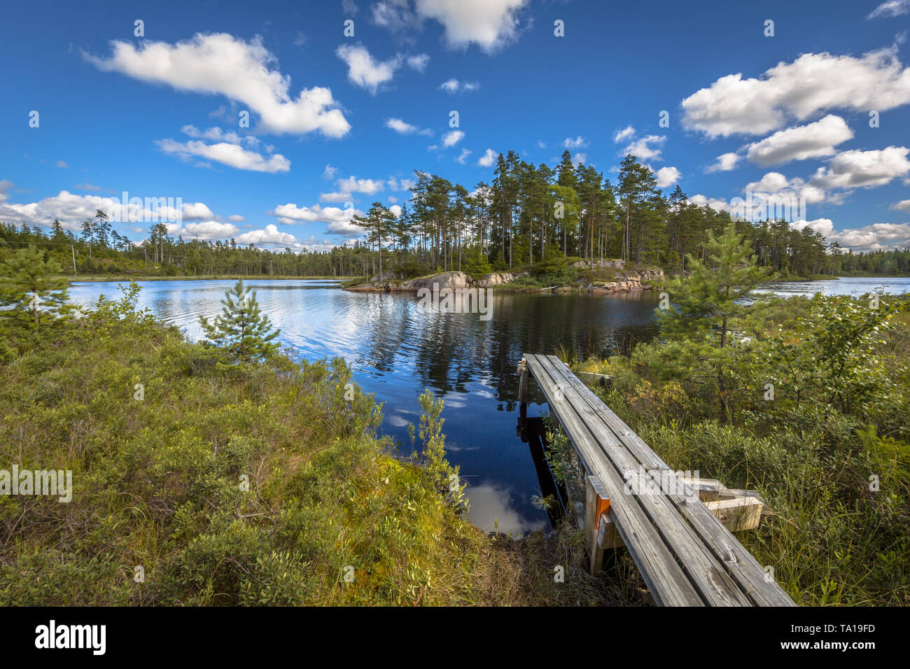 Lake with landing-stage in Glaskogen nature reserve Sweden Stock Photo
