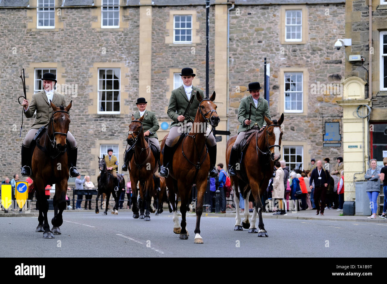 Hawick, Scottish Borders, UK. 21st May 2019. Hawick Common Riding 2019 Ñ Priesthaugh Rideout Caption: Cornet Connor Brunton (centre) leads nearly 100 mounted supporters away from Tower Knowe on the ride to Priesthaugh. Tuesday 23rd May sees the fourth preliminary ride out in the build up to the main Common Riding day on Friday 7th June 2019. Cornet Connor Brunton leads mounted supporters leaving the Backdamgate in Hawick at 2pm ( Credit: Rob Gray/Alamy Live News Stock Photo