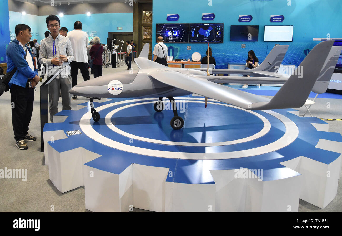 Beijing, China. 21st May, 2019. Visitors view a model of multi-use unmanned aerial vehicle in Beijing, capital of China, May 21, 2019. The 19th National Science and Technology Week is held from May 19 to 26. In Beijing, the main venue of the event, more than 410 major scientific and technological achievements in aerospace, artificial intelligence, information technology and biotechnology are displayed. Credit: Ren Chao/Xinhua/Alamy Live News Stock Photo