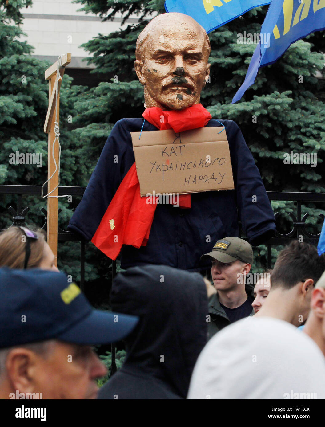 A gallows and a sculpture of the Soviet leader Vladimir Lenin with a placard  saying I am the executioner of the Ukrainian people is seen hanging on a fence of the Constitutional Court during the protest. Protesters stand against appeals of 46 Ukrainian lawmakers who appealed to the court to review the constitutionality of the law about decommunization. The law on decommunization was voted by the Ukrainian Parliament in April 2015, condemning communist and Nazi totalitarian regimes, banning their propaganda and symbolism. According to the law, the symbolic and propaganda of Nazism, National So Stock Photo