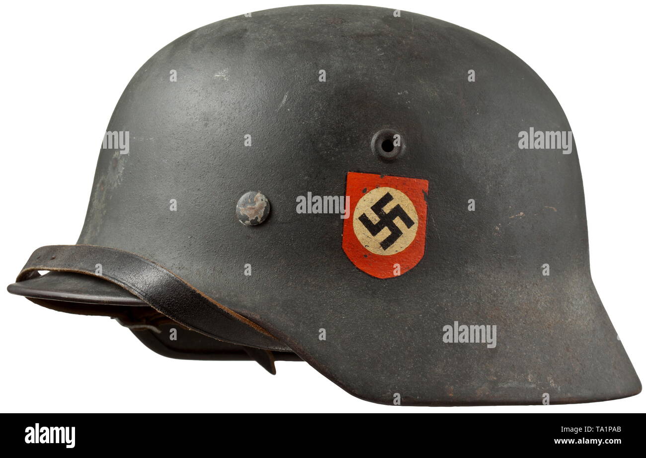 A steel helmet M 40 for members of the Waffen-SS with both emblems  Field-grey painted steel skull (four slight dents) with maker's stamp  "NS62" (Schwerte Nickel Works) and "DN95". Both emblems are