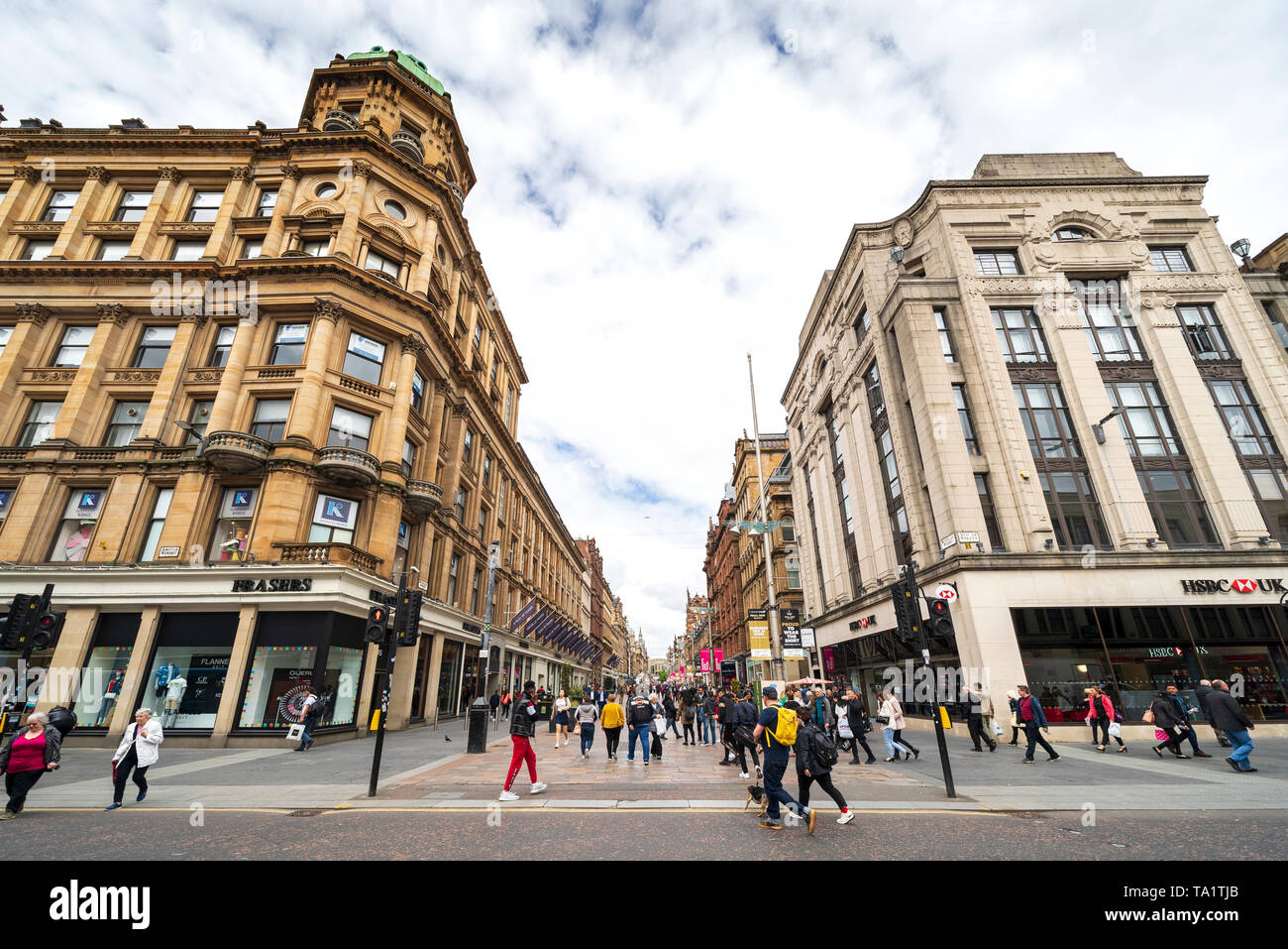 View of shoppers and shops on Buchanan Street the main pedestrian shopping street in Glasgow