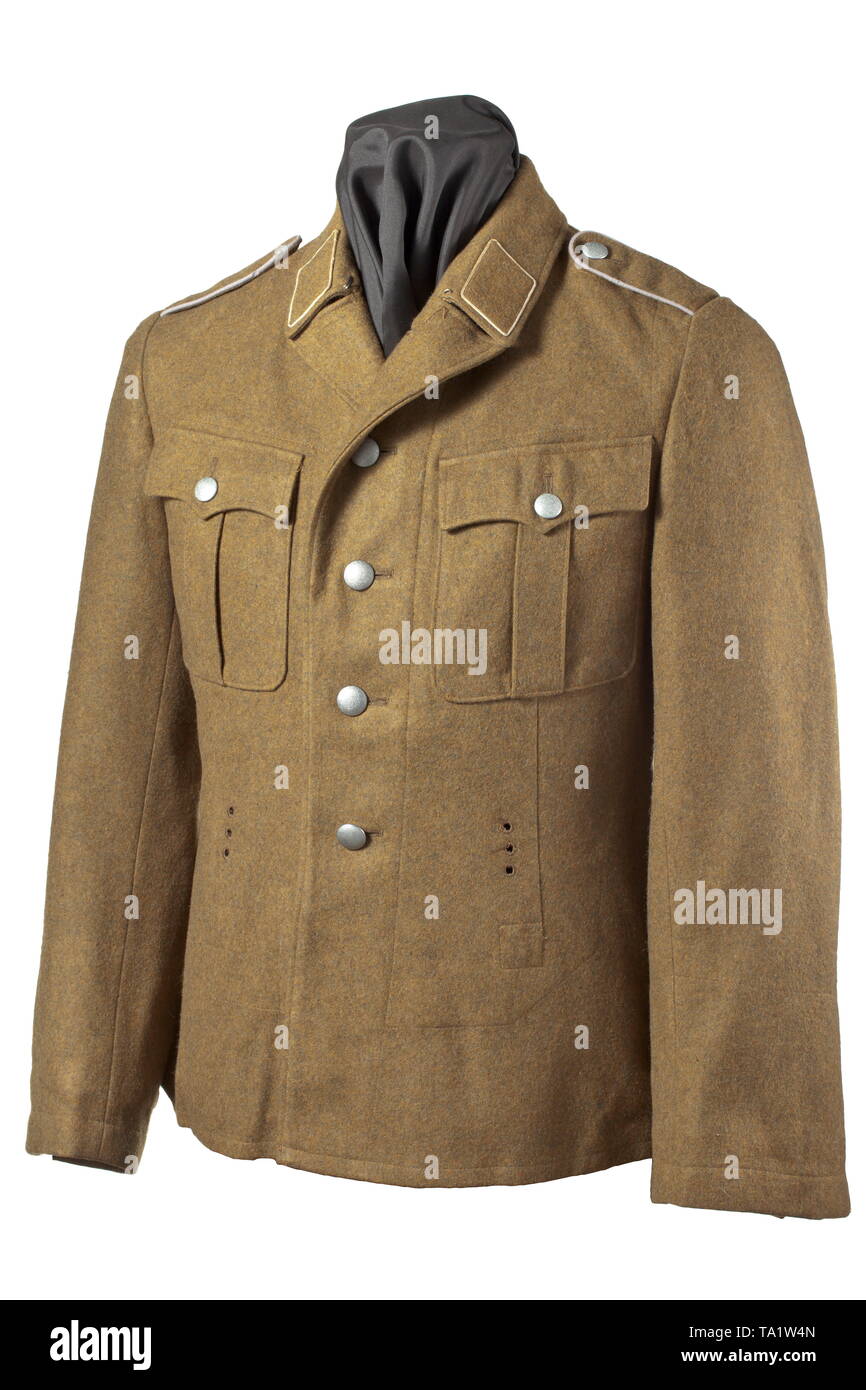 A mountain jacket for members of SA military training defense groups depot piece with RZM tag Brown woollen cloth with silver RZM buttons, brown cotton liner with superimposed inner pockets within which is an RZM tag 'Bergrock (Feldbluse) SA. aus Tuch'. Size stamping '50'. Collar tabs of base cloth with white cord edging, sewn-in shoulder boards with the silver-grey piping for army training. A rare coat. historic, historical, 20th century, Editorial-Use-Only Stock Photo