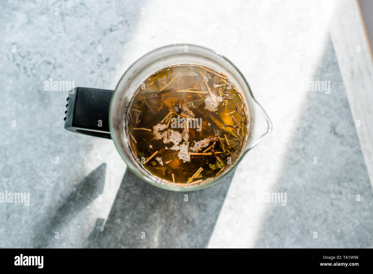 Green Tea with French Press in Daylight. Organic Hot Beverage Stock